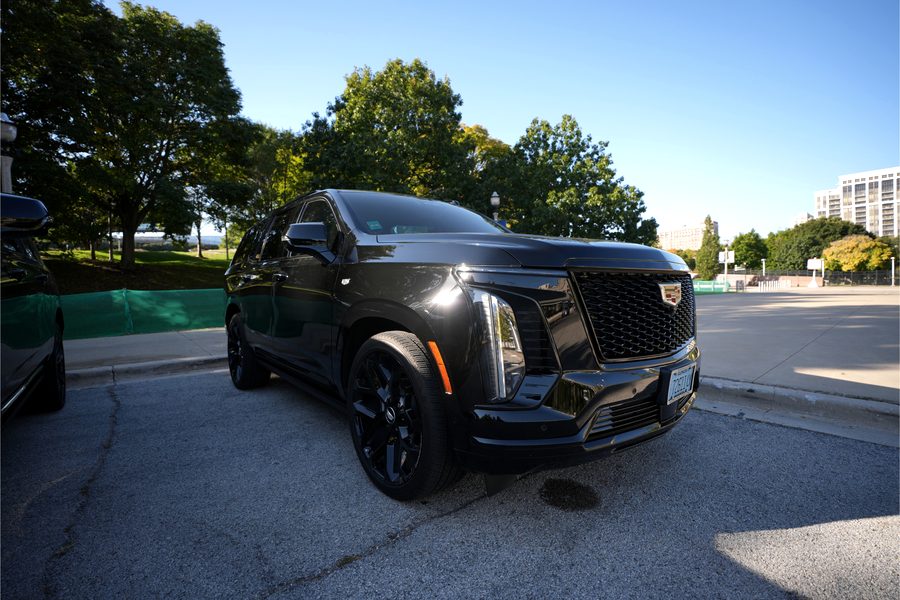 Premium SUV (Escalade-class) — black luxury vehicle, front view